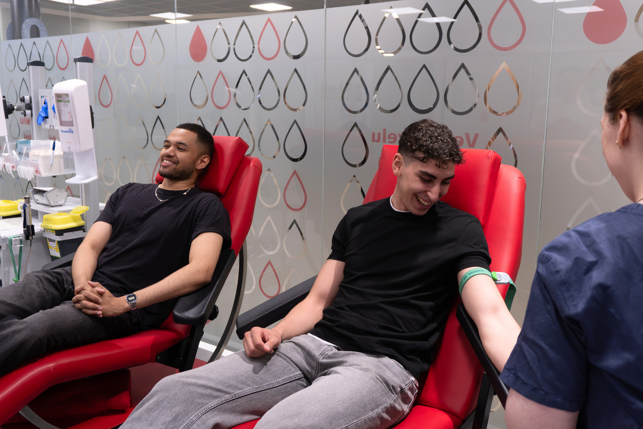 Two men and a Blood Service nurse.