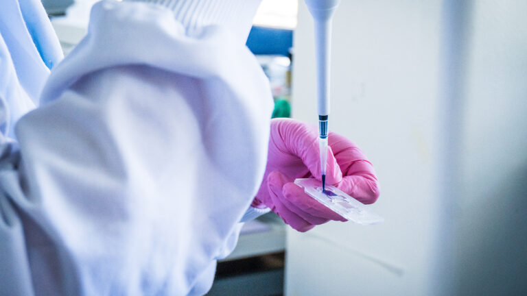 Pipetting the biobank sample.