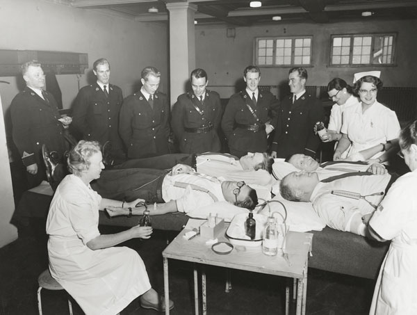 Central police personnel at mass blood donation in 1956.