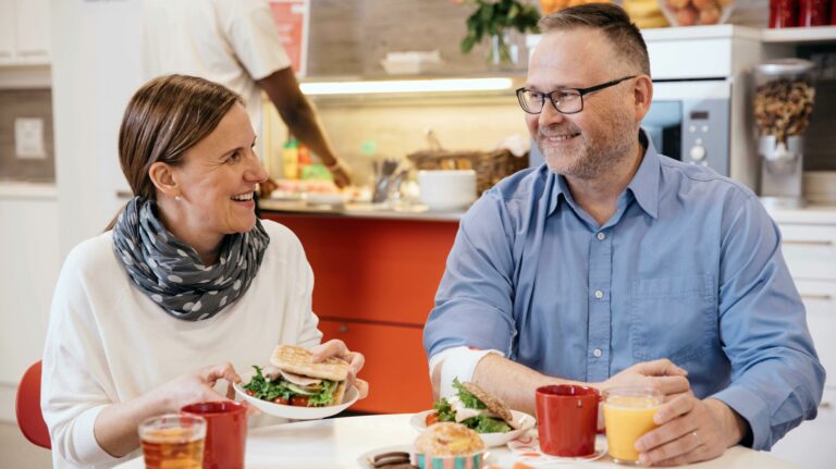 A woman and a man having coffee.