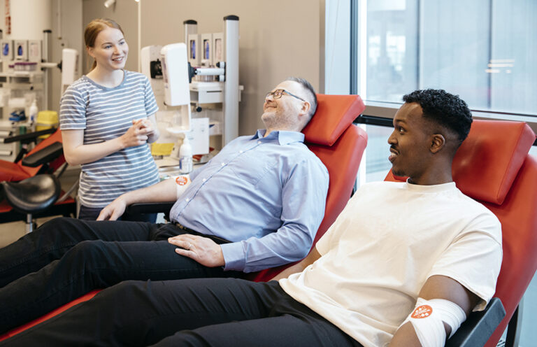 Two blood donors and a nurse at Blood Service in Espoo.