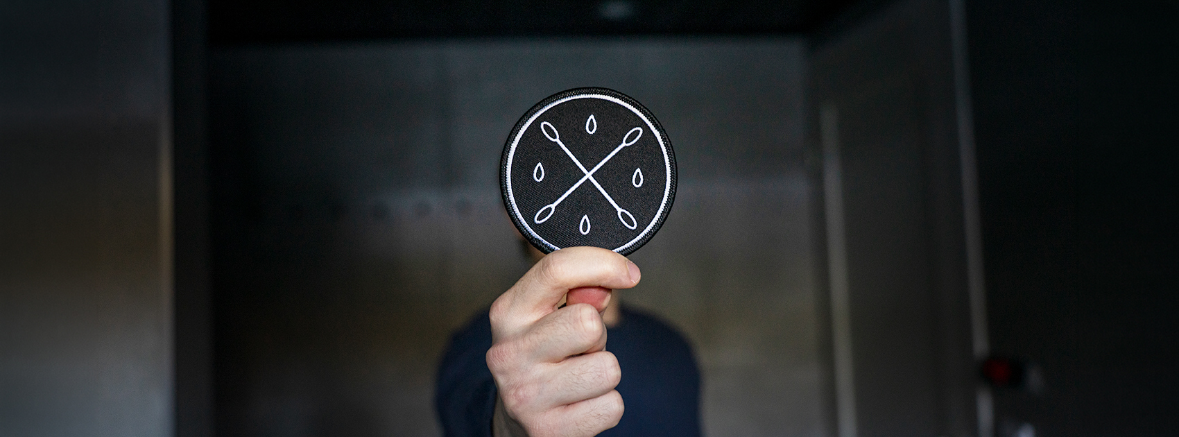 The Stem Cell Registry fabric badge in the hand of a new registrant.