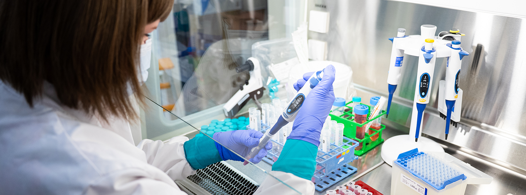 A Blood Service researcher handling samples in the laboratory.